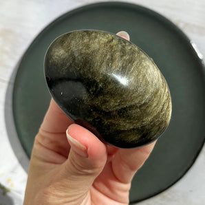 Guld obsidian palm stone