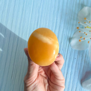 Orange calcit palm stone